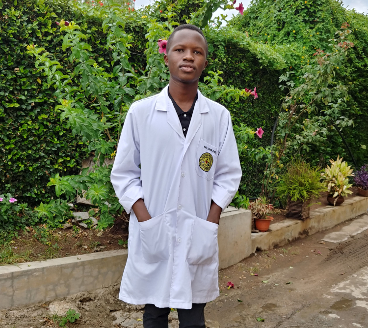 Student outside with hands in pockets